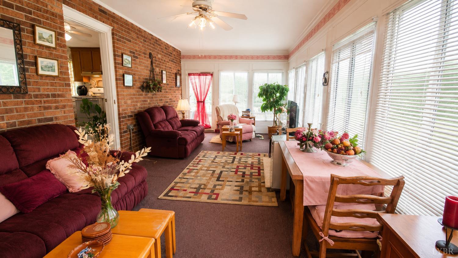 2346 Mitchell Mill Road Gladys, VA 24554 - Photo 14 of 38 a living room with furniture fireplace and a large window