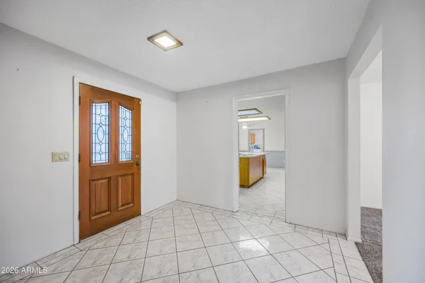 a kitchen with a stove a refrigerator and cabinets