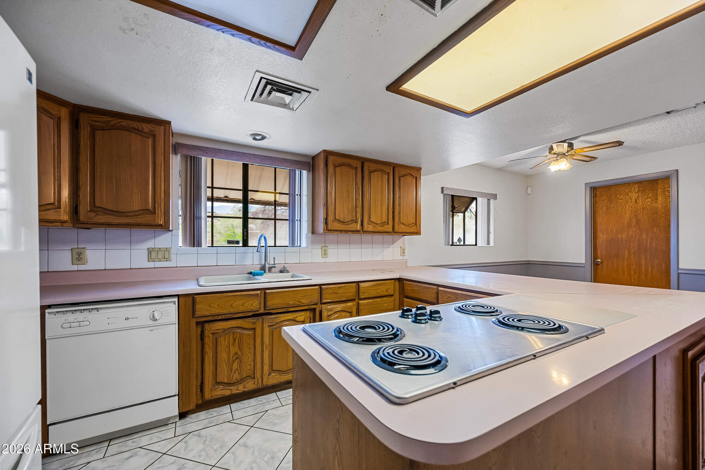 7358 Alamo Way Globe, AZ 85501 - Photo 20 of 68 a kitchen with a stove a sink and a microwave
