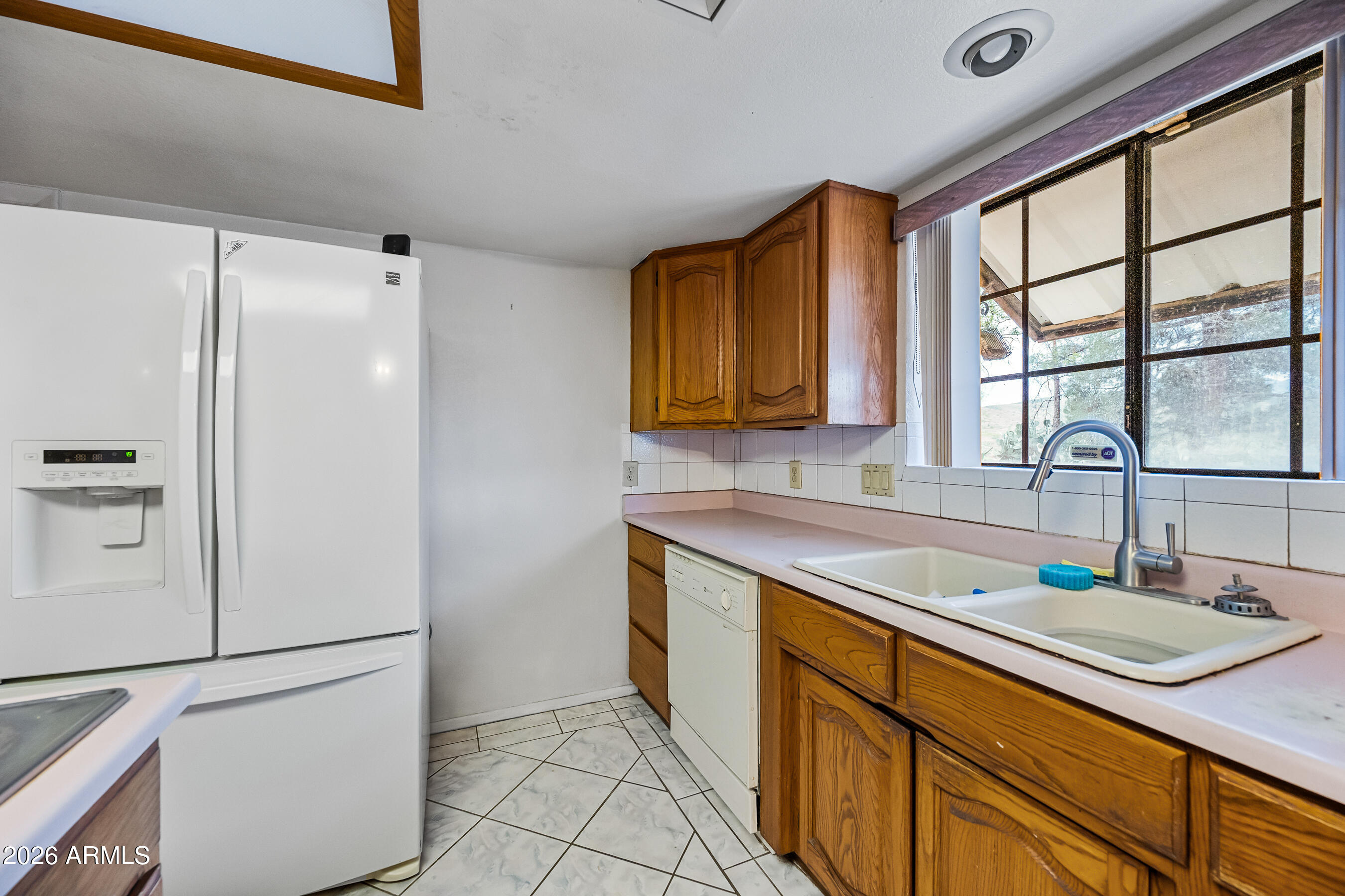 7358 Alamo Way Globe, AZ 85501 - Photo 21 of 68 a kitchen with stainless steel appliances granite countertop a refrigerator and a sink