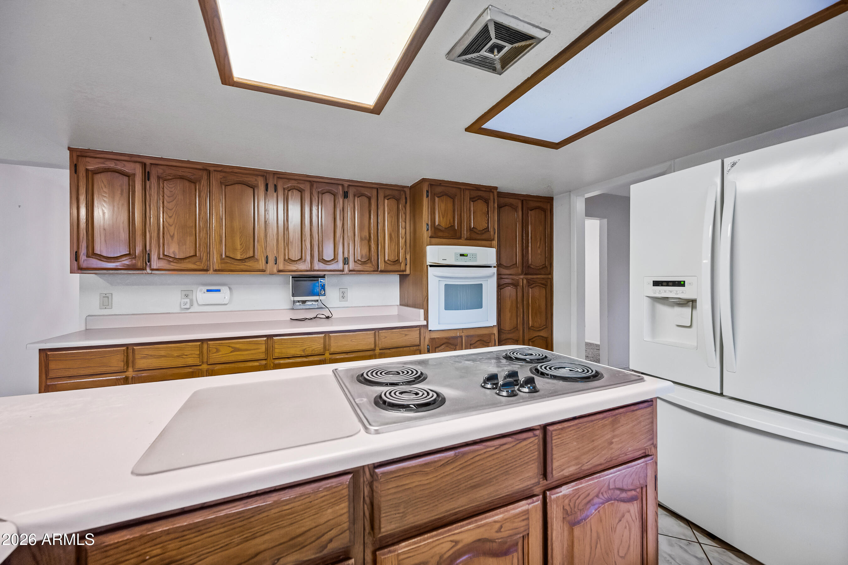 7358 Alamo Way Globe, AZ 85501 - Photo 22 of 68 a kitchen with a stove a refrigerator and cabinets