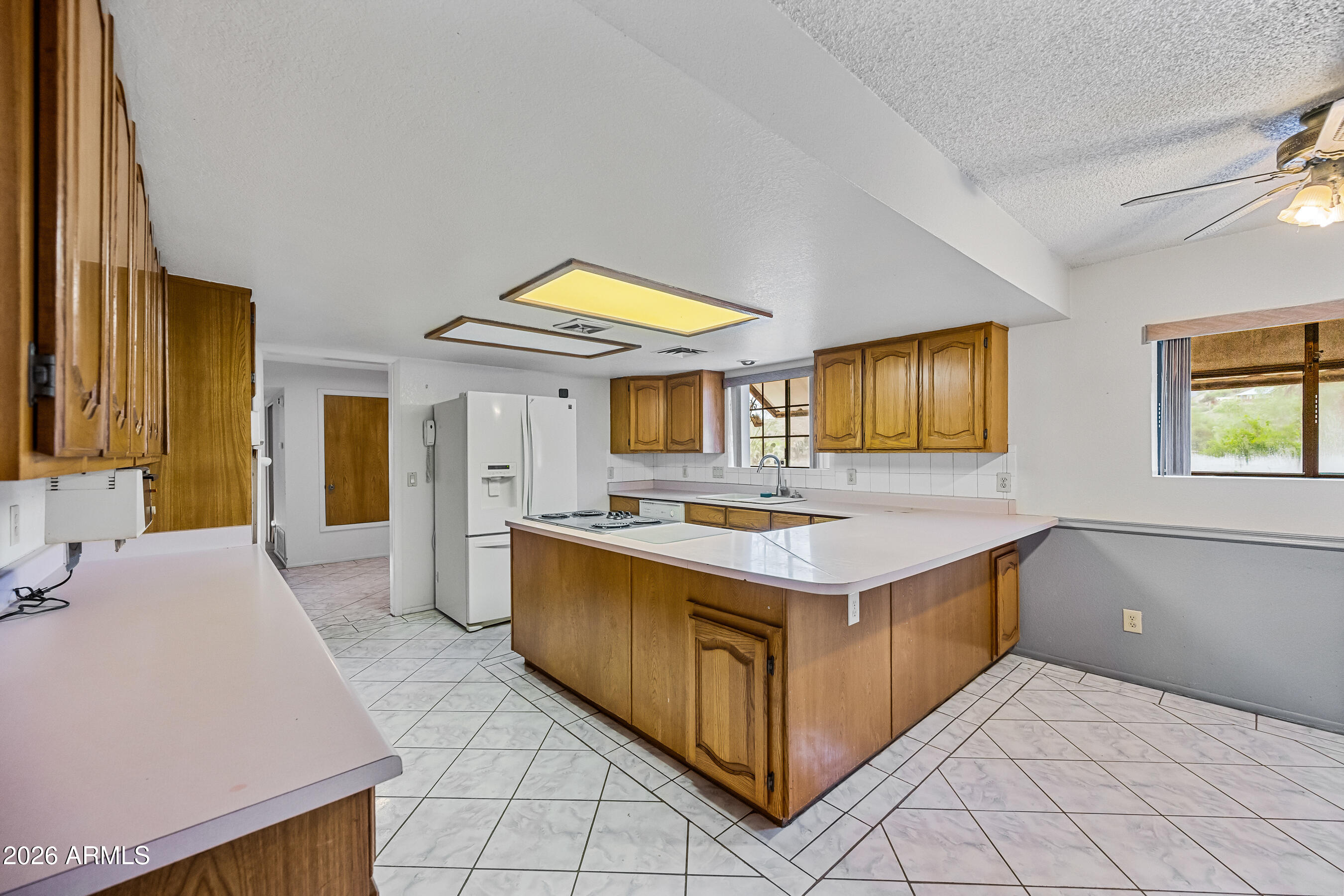 7358 Alamo Way Globe, AZ 85501 - Photo 23 of 68 a kitchen with a stove and a sink