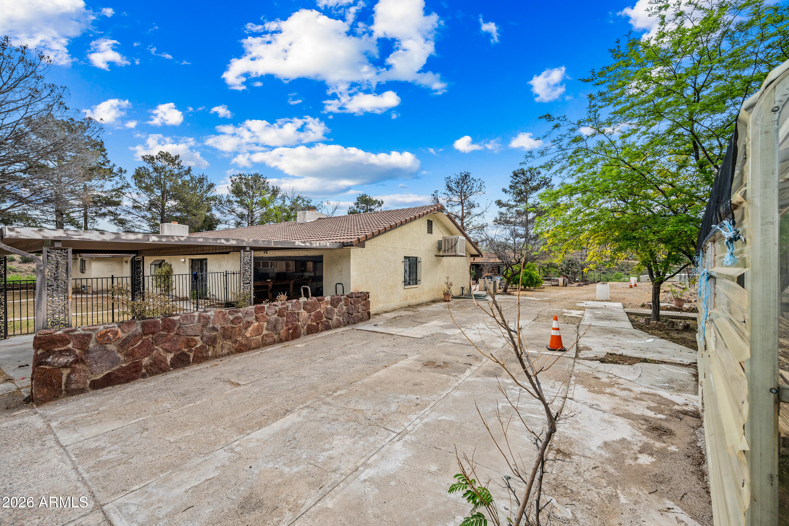 7358 Alamo Way Globe, AZ 85501 - Photo 3 of 68 a view of a house with a tree in the background