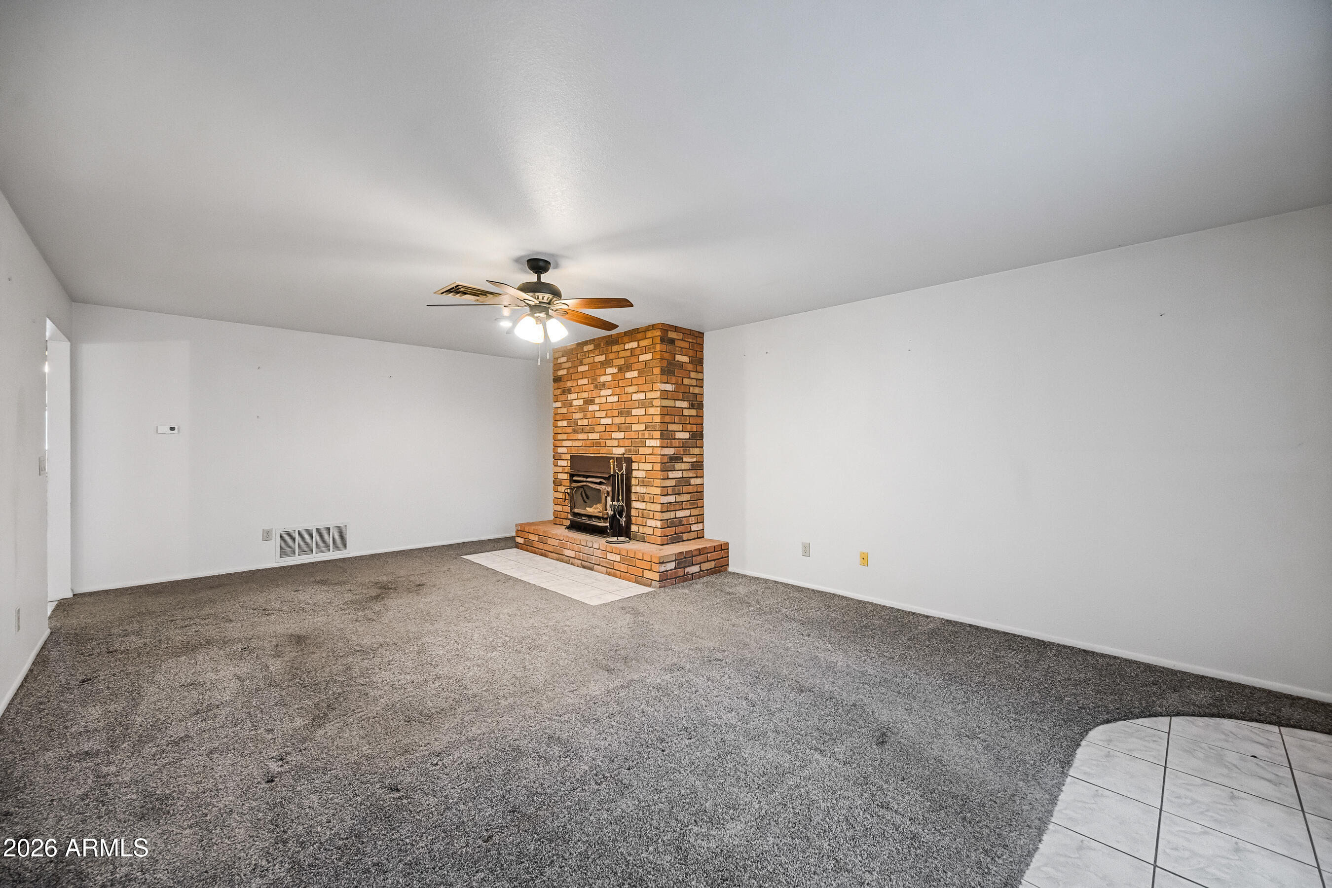 7358 Alamo Way Globe, AZ 85501 - Photo 7 of 68 an empty room with windows