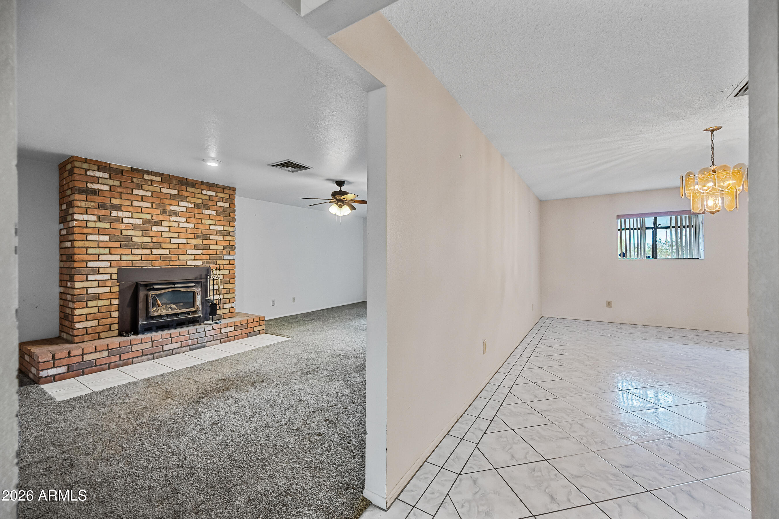 7358 Alamo Way Globe, AZ 85501 - Photo 10 of 68 a view of empty room with a fireplace