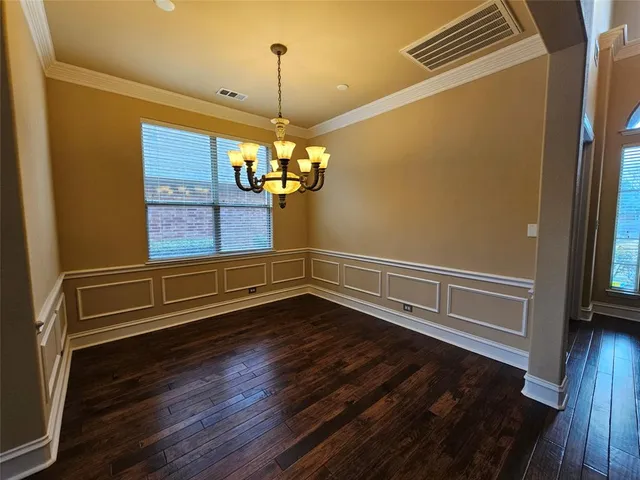 a view of room with wooden floor and staircase