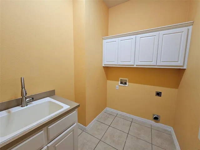 a bathroom with a sink and cabinets