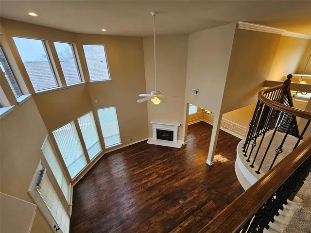 a view of an entryway with wooden floor