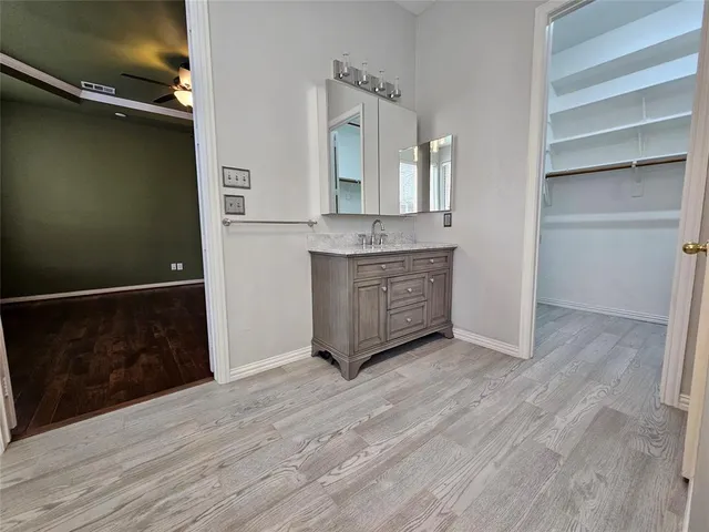 a room view with wooden floor and staircase
