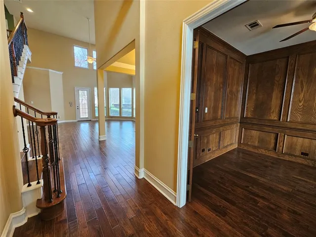 a view of an entryway with wooden floor