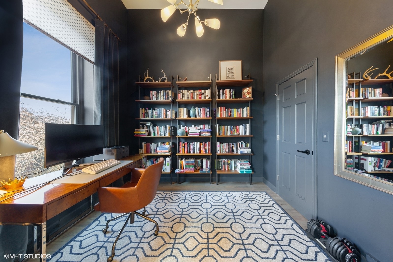 2849 North Burling Street, Unit 3 Chicago, IL 60657 - Photo 10 of 18 a view of a workspace with furniture and a bookshelf