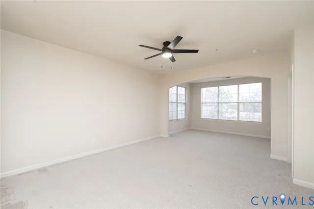 a view of empty room with windows