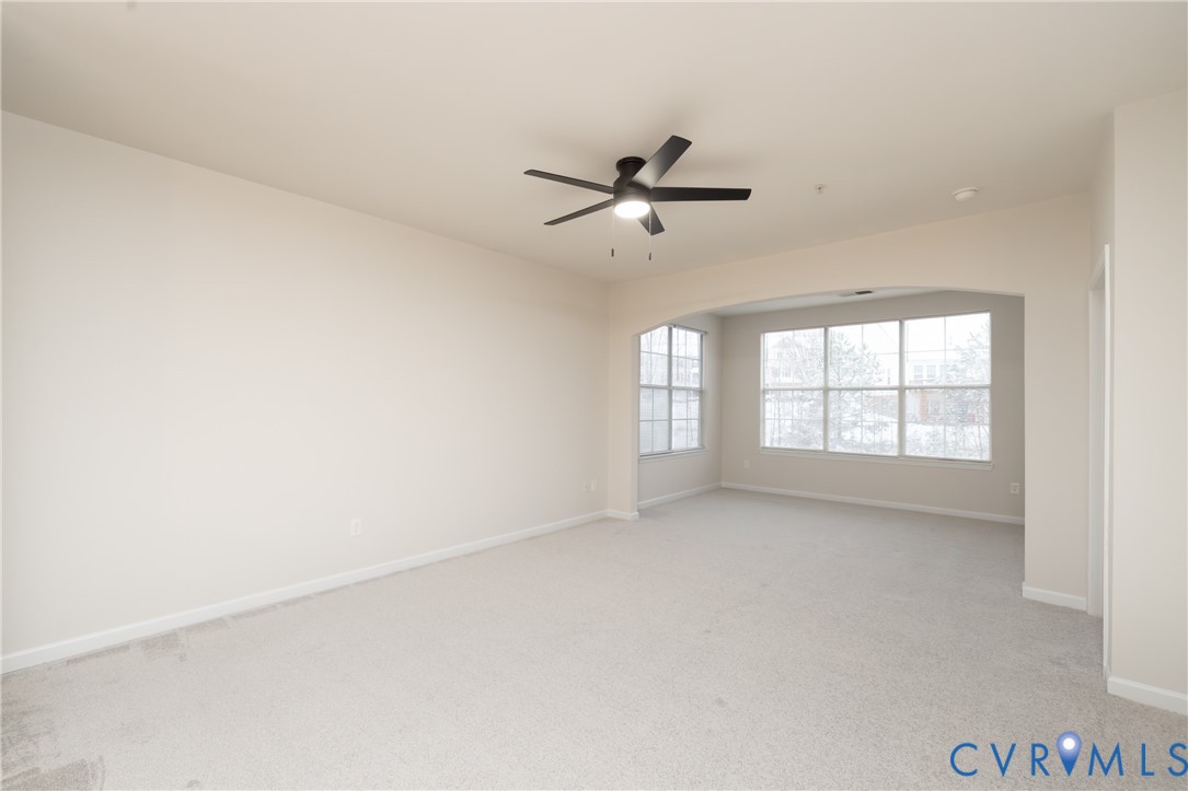 734 Bristol Village Drive, Unit 208 Midlothian, VA 23114 - Photo 9 of 24 a view of empty room with windows