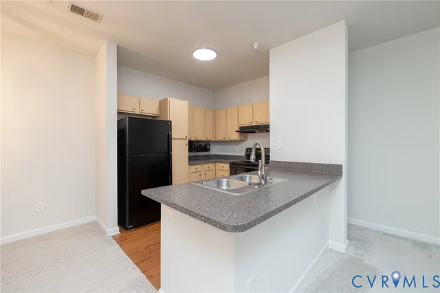 a kitchen with refrigerator and countertop