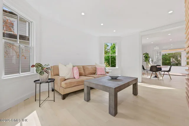 a living room with furniture and windows