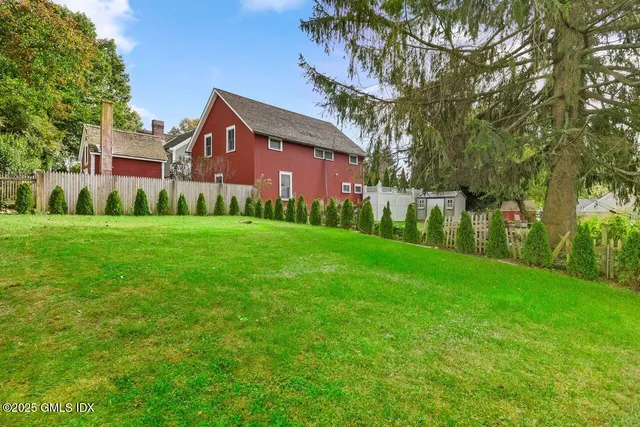 a view of a building with a yard