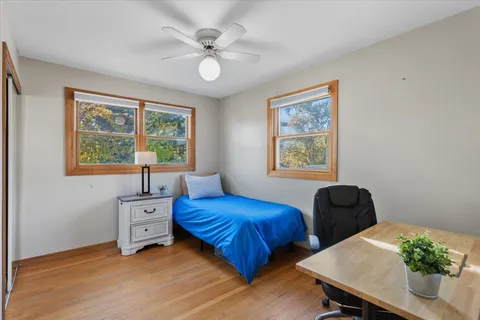 a bedroom with furniture and a window