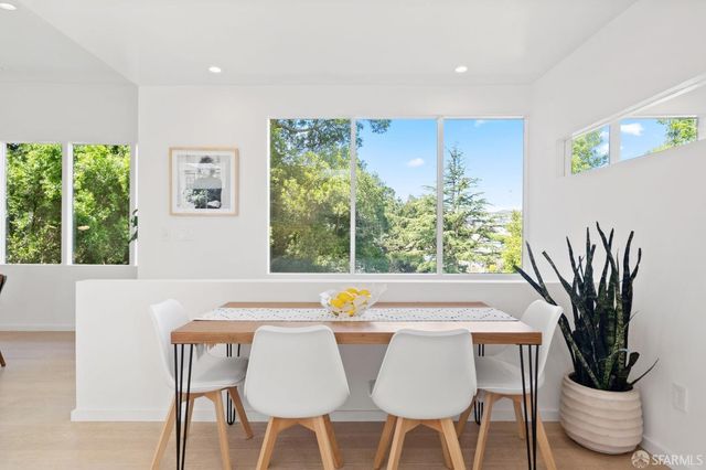 a bedroom with a large bed and a large window