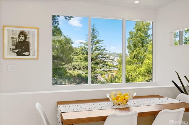 a bedroom with a bed and a large mirror