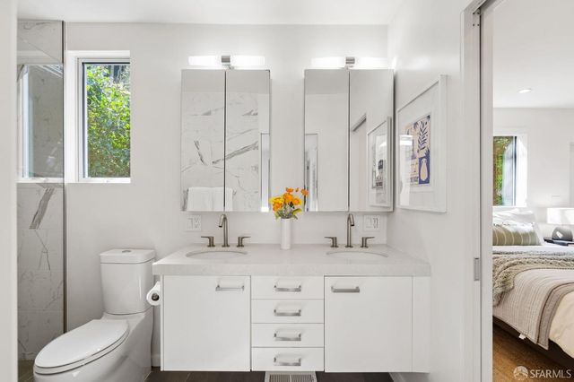 a view of a porch with furniture and floor to ceiling window