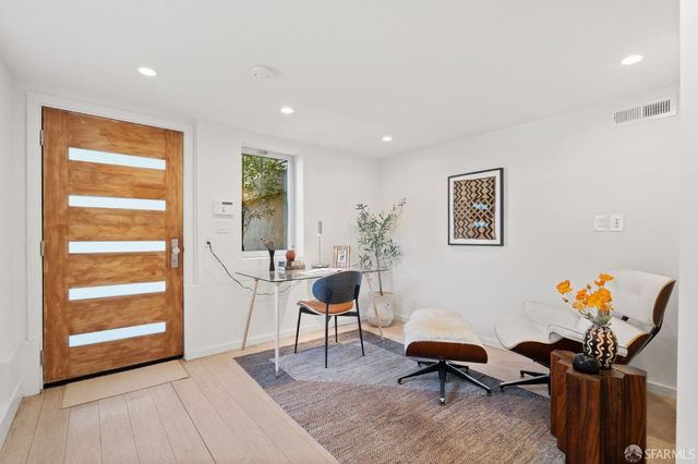 a front view of a house with outdoor seating