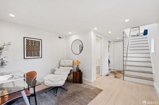 a view of a backyard with sitting area