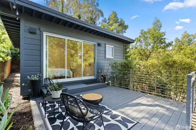 a view of a balcony with chairs