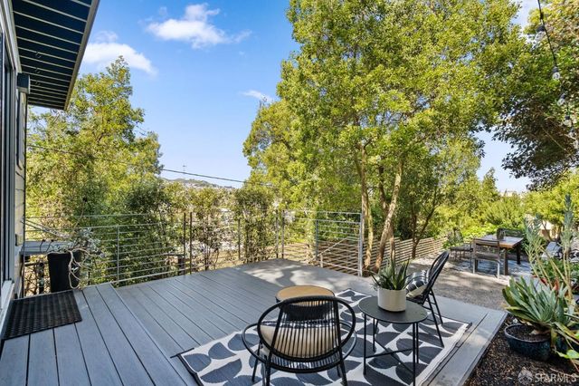 a view of a backyard with sitting area