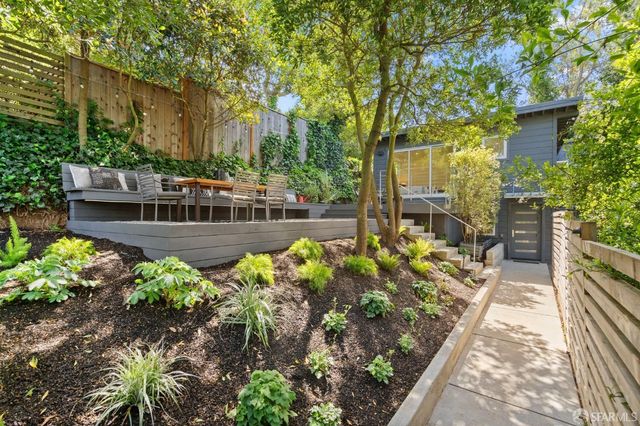 a view of a porch with furniture and floor to ceiling window
