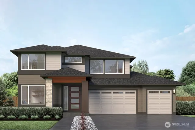 a front view of a house with garage