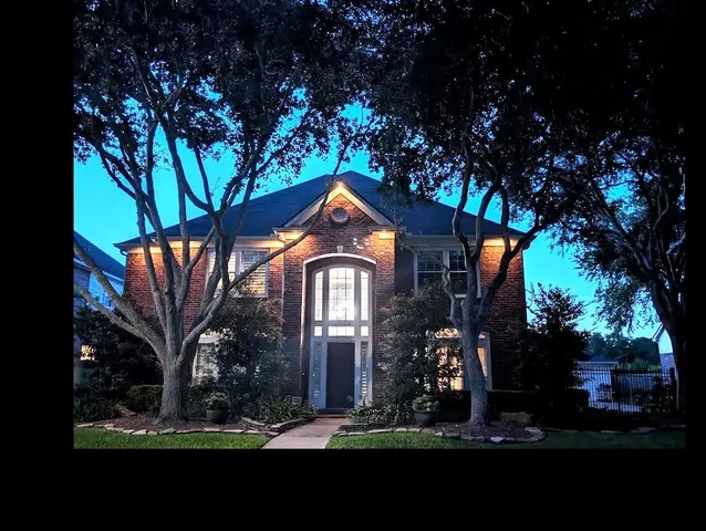 a view of a workspace with furniture and wooden floor