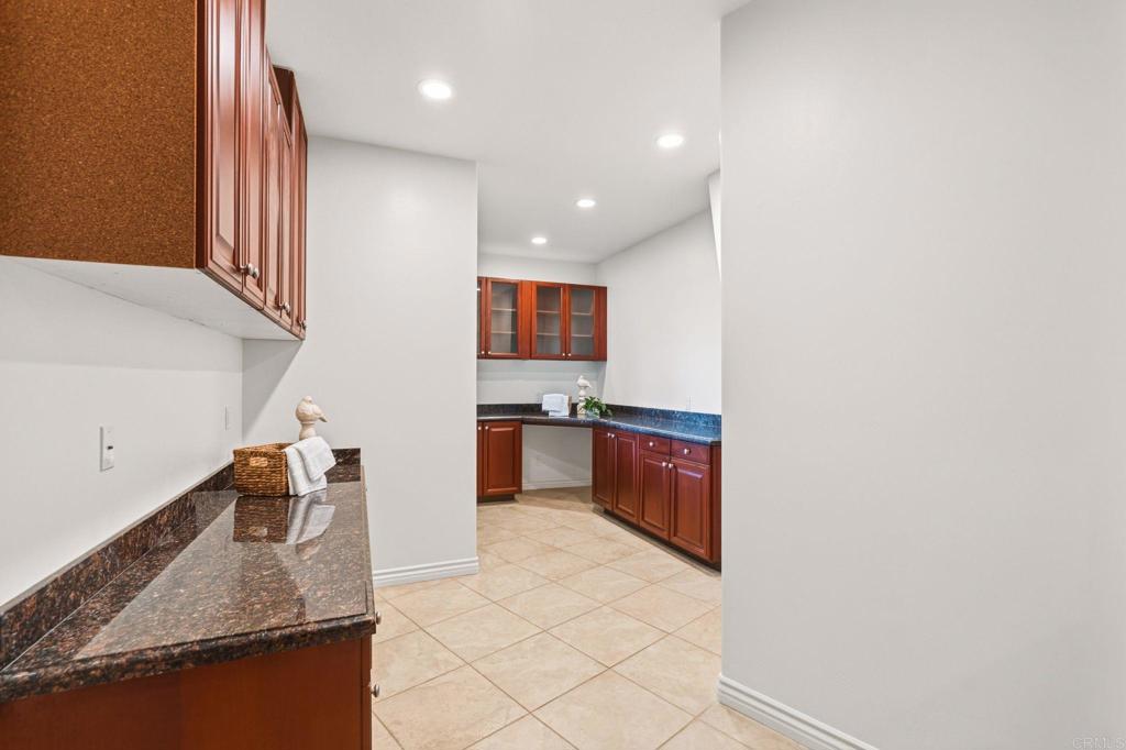 13319 Pacer Lane Poway, CA 92064 - Photo 46 of 75 a kitchen with granite countertop a sink and a stove top oven