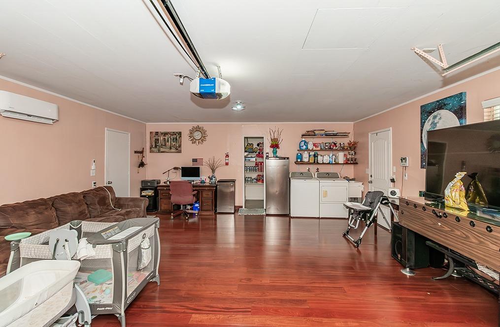 3012 Stanford Avenue Clovis, CA 93611 - Photo 24 of 41 a living room with furniture and a flat screen tv
