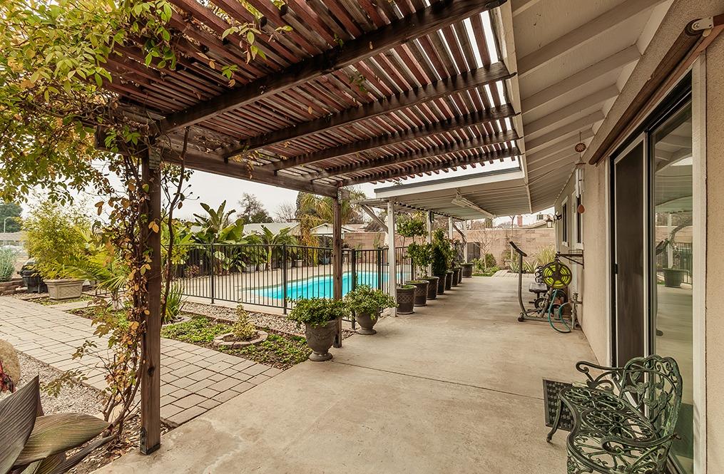 3012 Stanford Avenue Clovis, CA 93611 - Photo 30 of 41 a view of a porch with furniture and floor to ceiling window