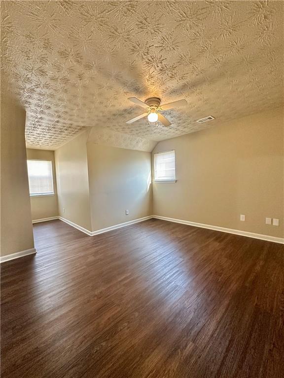 2603 Old Rex Morrow Road Ellenwood, GA 30294 - Photo 17 of 17 an empty room with wooden floor and windows
