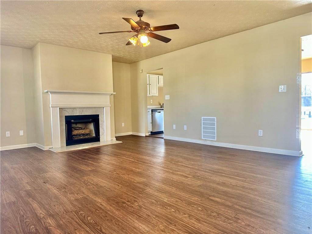 2603 Old Rex Morrow Road Ellenwood, GA 30294 - Photo 2 of 17 a view of an empty room with a fireplace and a window