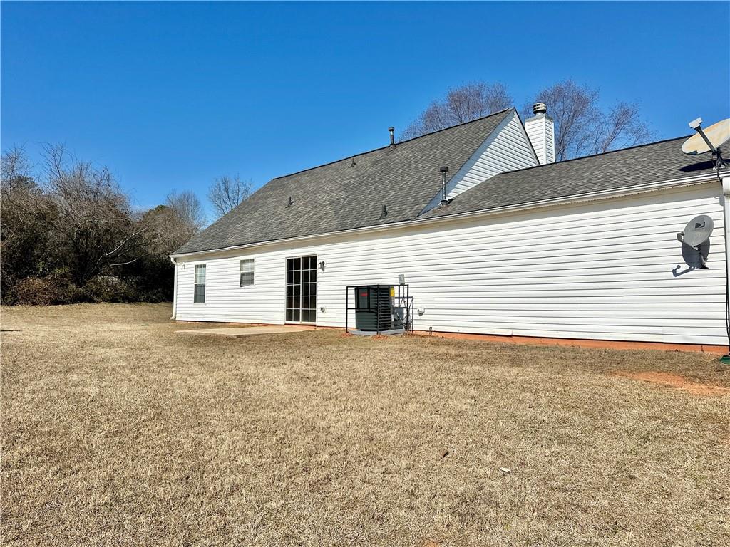 2603 Old Rex Morrow Road Ellenwood, GA 30294 - Photo 6 of 17 a view of a house with a backyard