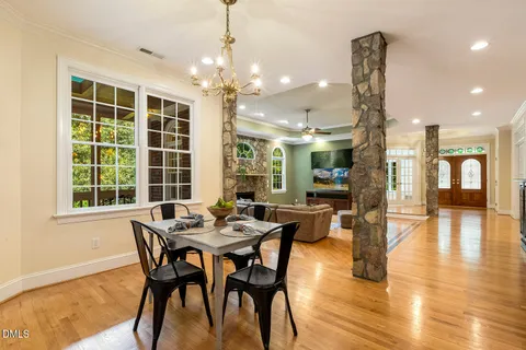a view of a dining room with furniture window and wooden floor