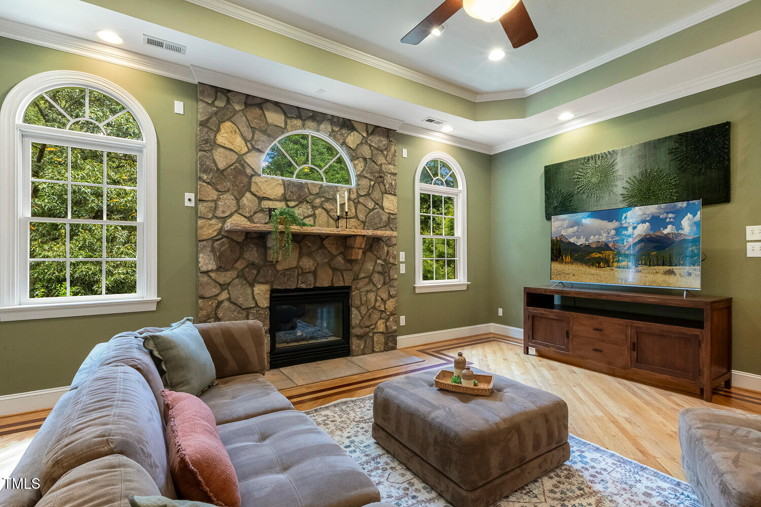 1505 October Road Raleigh, NC 27614 - Photo 16 of 76 a living room with furniture and a flat screen tv