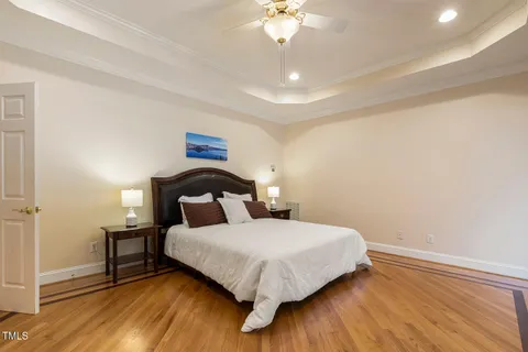 a balcony with hardwood filled with table and chairs
