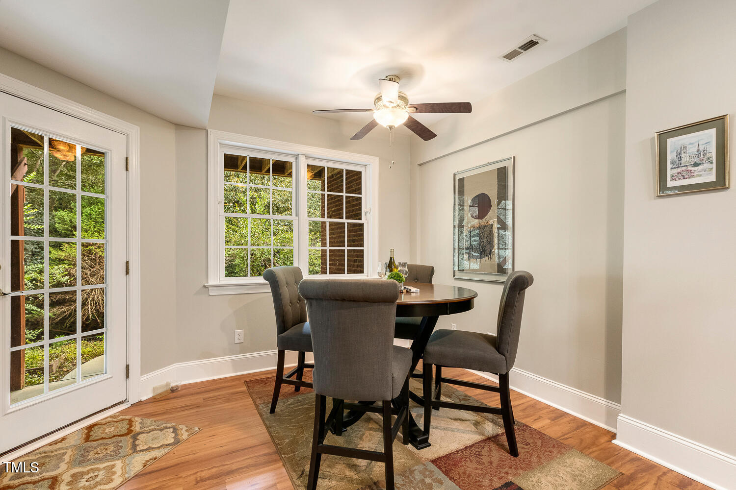 1505 October Road Raleigh, NC 27614 - Photo 39 of 76 a view of a dining room with furniture window and wooden floor
