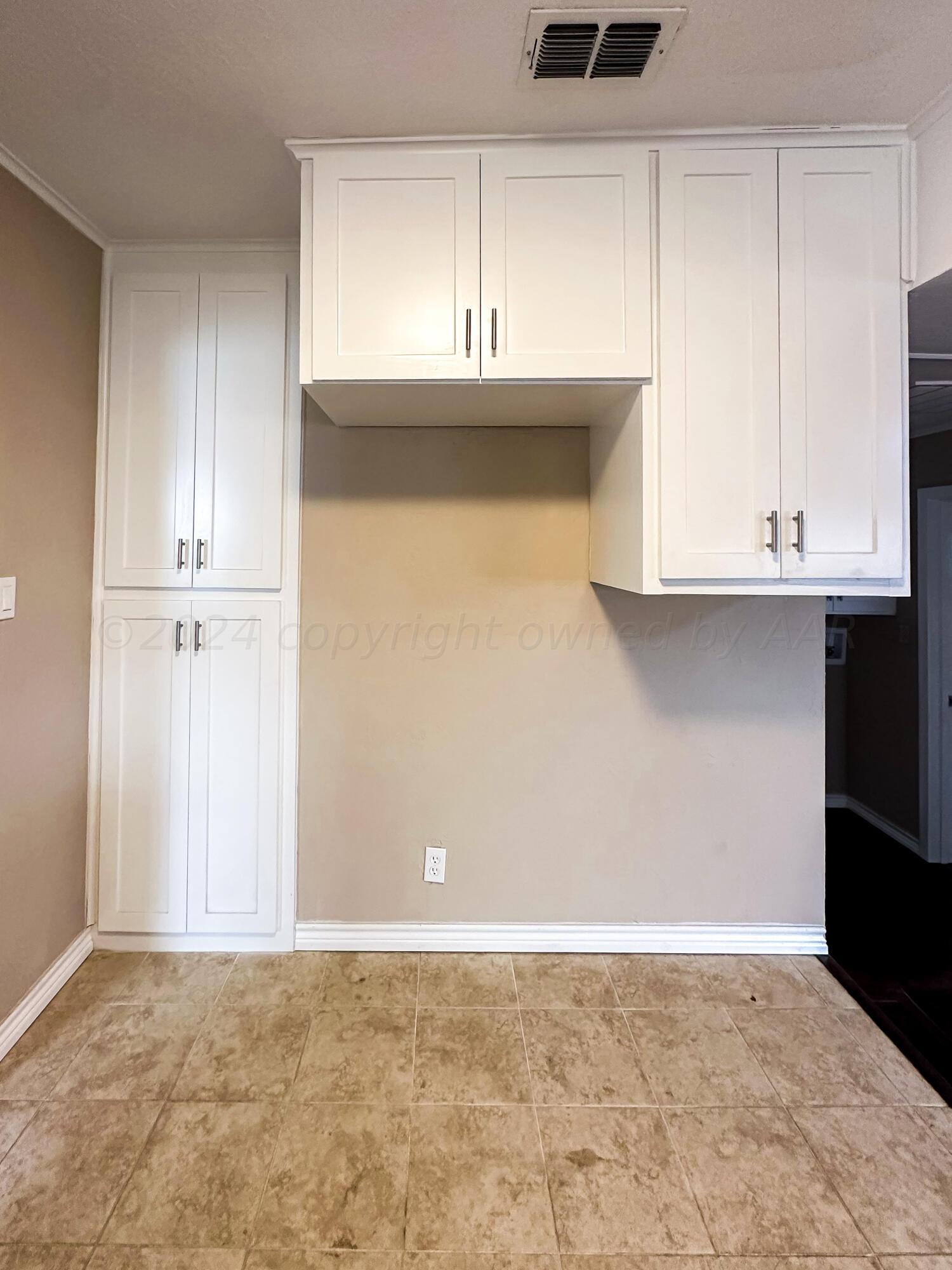 1103 Madison Street Borger, TX 79007 - Photo 8 of 16 a view of kitchen with a sink and cabinets