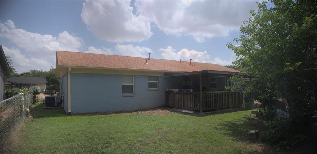 531 Ridgecrest Drive Lewisville, TX 75067 - Photo 5 of 10 a backyard of a house with table and chairs