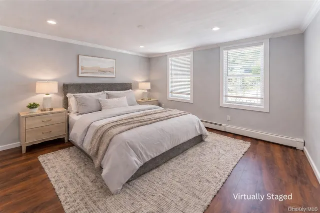 a bedroom with a bed and a night stand