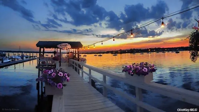 a view of ocean with sunset