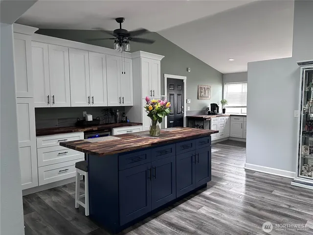 a kitchen with stainless steel appliances granite countertop a sink and cabinets