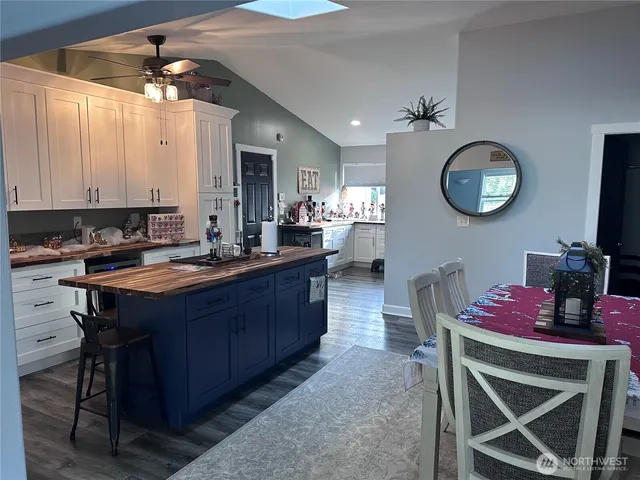 a kitchen with a sink cabinets and window