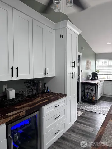 a kitchen with stainless steel appliances a stove a refrigerator and cabinets