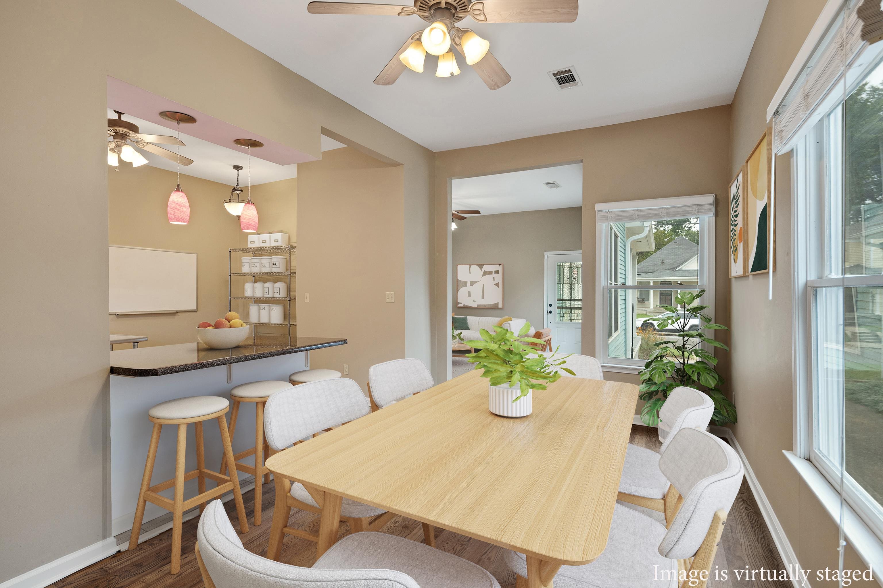 1003 New York Street Memphis, TN 38104 - Photo 12 of 40 a view of a dining room with furniture and chandelier