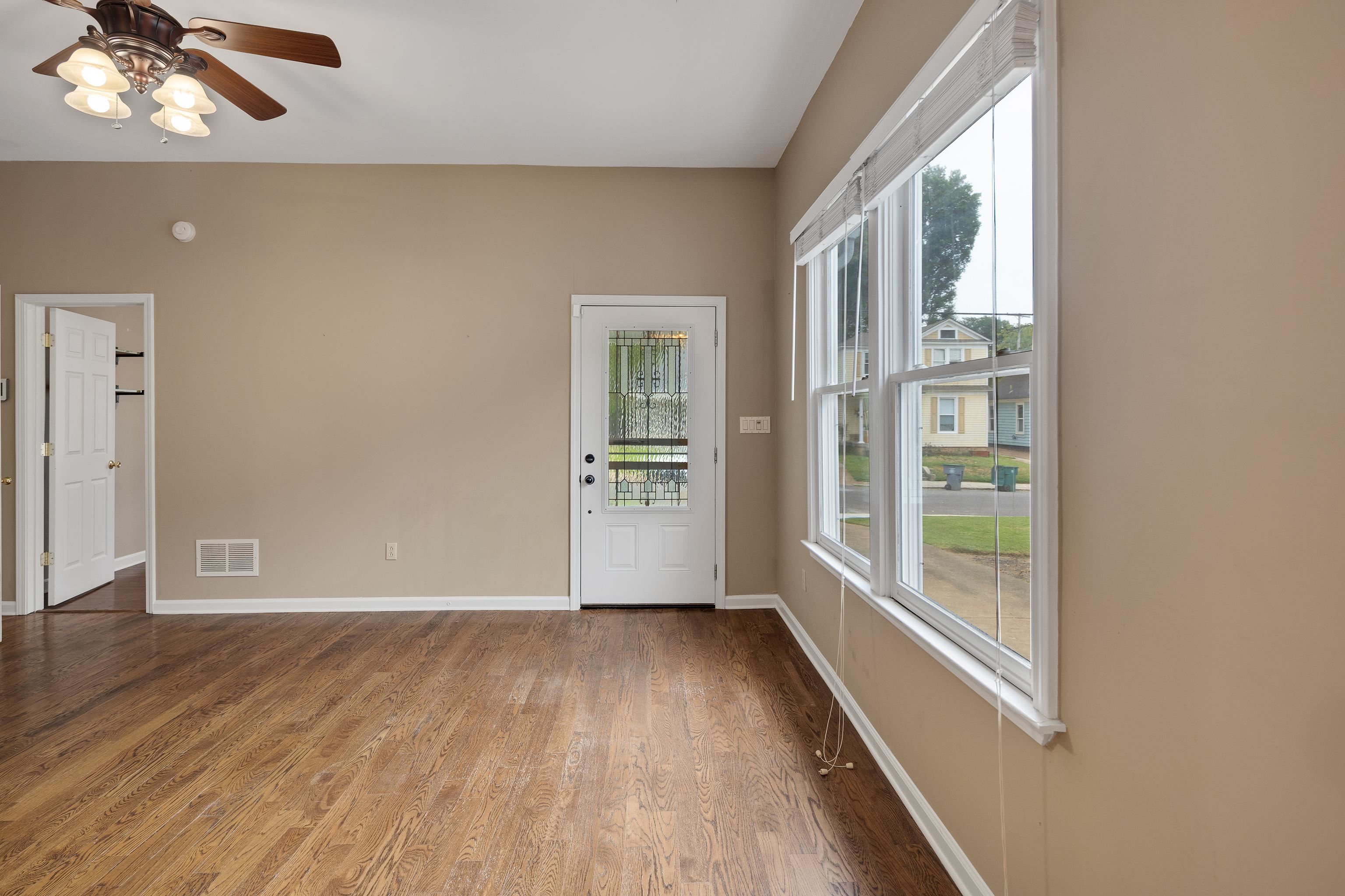 1003 New York Street Memphis, TN 38104 - Photo 19 of 40 wooden floor in an empty room with a window